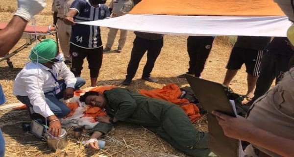 Safely ejected Indian Air Force Pilot being given first aid by local medicos